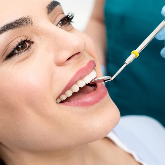 Dental treatment of female. Close up woman getting a dental treatment